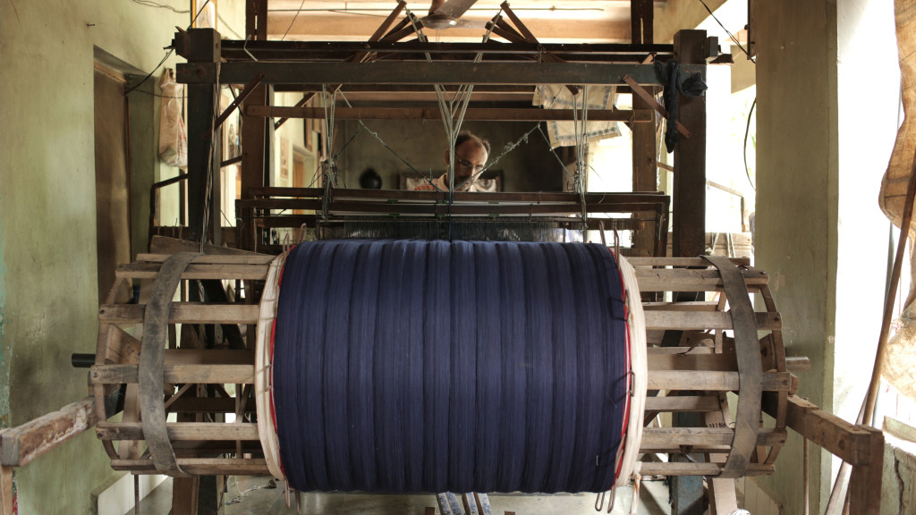 Indigo-dyed khadi yarn on the loom, Gujarat | credit: Sam Fleischner