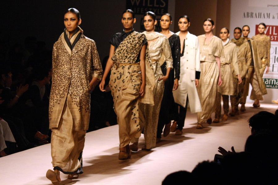 Models showcase designers Abraham and Thakore's creations during Wills Lifestyle India Fashion Week Autumn-Winter'14 in New Delhi on March 28, 2014. (Photo: Amlan Paliwal/IANS)